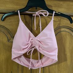 80% Nylon 20% Spandex Pink Stretch Halter Top With Built-in Bra, Pink Stretch Halter Top For Swimming, Sleeveless Seamless Pink Swimwear, Pink Fitted Halter Top With Built-in Bra, Fitted Pink Halter Top With Built-in Bra, Pink Halter Neck Swimwear With Built-in Bra, Pink Fitted Halter Top For Beach Party, Fitted Pink Halter Top For Beach Party, Pink Stretch Triangle Halter Top