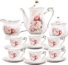 a tea set with pink roses on it