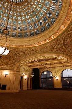 the inside of a building with a domed ceiling and chandelier hanging from the ceiling