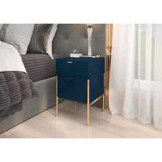 a night stand next to a bed in a bedroom