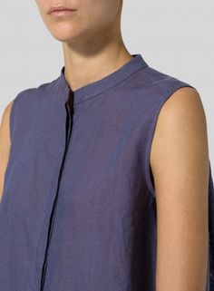 Linen A-line Sleeveless Top with Mandarin Collar Chic Fitted A-line Tops, Elegant Sleeveless Linen Top, Casual A-line Spring Tops, Casual Sleeveless Blouse For Layering, Versatile Summer Vest, Versatile Sleeveless Linen Top, Versatile Sleeveless Blouse For Layering, Linen Sleeveless Vest For Layering, Chic Sleeveless Tops For Layering