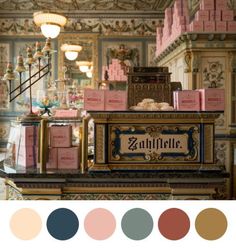 an old fashioned cash register in a store with lots of pink and blue boxes on it