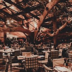 an indoor dining area with tables and chairs