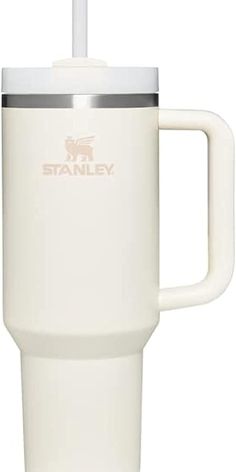 a white travel mug with a straw sticking out of it's lid and handle