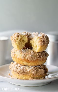 three gluten - free crumb donuts stacked on top of each other