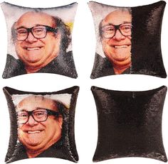 four sequinized pillows with an image of a smiling man in glasses on them