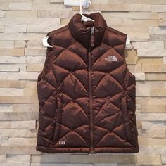 North Face Womens Puffer Vest Product Details Brand - The North Face Material - 550 Goose Down Insulation Color - Brown Size - Women's Xs Condition - Excellent Style - Winter Puff Vest Jacket Measurements Top To Bottom Length - 24" Pit To Pit - 19" #Tags - Retro 1996 Puffy Ladies Women Nupse Vests Northface Tnf A15 (Id-10-1049) Puffer Vest Jacket, Puff Vest, North Face Womens, North Face Coat, Womens Puffer Vest, Puffy Vest, North Face Women, Puffer Vest, North Face Jacket