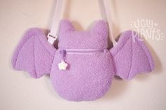 BOO! wHAT, you're saying I DIDN'T scare you??? You say my face is too cute!??! This bat plush purse is ready to accompany you on your adventures this spooky season! When is spooky season you ask? It's now! It's all the time!!!! 10" tall (from ear to booty) 18" wide (wing to wing). Straps max out at 50" and are adjustable- making these perfect for humans of all shapes and sizes! Kids, adults, you name it. Zipper opening is approx. 5.5 inches Interior depth of the pouch is approx. 5.5 inches. Just Bat Plush, Pastel Goth Fashion, Spooky Cute, Plush Bags, Cute Bat, Novelty Bags, Creepy Cute, Cute Plush, Cute Bags