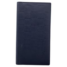 Louis Vuitton Black Damier Infini Vertical Wallet. 2 side pockets and 3 credit card slots inside. Authenticity Serial Number TH0061inside one of the pockets. 'LOUIS VUITTON Paris - made in France' engraved inside. Details MATERIAL: Leather COLOR: Black MODEL: Bifold Long Wallet GENDER: Unisex Adults COUNTRY OF MANUFACTURE: France SIZE: Medium TYPE: YEAR MANUFACTURED: 2000-2009 DUSTBAG? No BOX? No KEYS? No Condition A - EXCELLENT Gently used. Some normal wear of use on the exterior and on the int Louis Vuitton Paris, Louis Vuitton Black, Louis Vuitton Wallet, Black Model, Small Accessories, Long Wallet, Fashion Handbags, Purse Wallet, Made In France