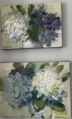 two paintings with flowers are hanging on the wall