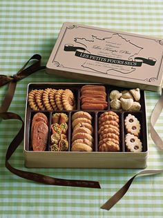 an open box of cookies sitting on top of a table