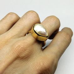 This is a handmade pearl ring using a one of a kind asymmetrical pearl with a drop shape (almost).Please have in mind that every pearl used for this ring is unique so every ring is will be unique. The band for this ring is made of sterling silver rectanle wire 1.8mm.The ring can be made in sterling Gold Coin Ring, Ring Minimal, Hammered Bangles, Stackable Ring Sets, Ring Pearl, Minimal Ring, Stacking Ring Set, Bangle Bracelet Set, Gold Statement Ring