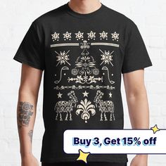 a man wearing a black t - shirt with christmas designs on it