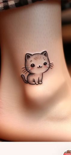 a small cat tattoo on the ankle