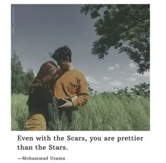 two people standing in tall grass with the caption even with the scars, you are prettier than the stars