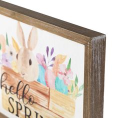 a wooden sign that says hello spring with some rabbits in the box and flowers on it