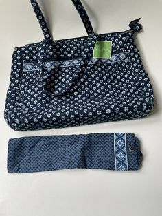 Vera Bradley Metropolitan Nantucket Navy Handbag Purse Shoulder Bag Retired Pattern Condition: very clean inside and outside, has some damage on bottom corners from long storage. Please see the pictures  Top zip closer  3 compartments inside, the middle zip closes Inside 2 slip pockets and one zipper close pocket Outside one large zip close pocket and 2 side pockets Measurements approx.: 18 in X 14 in X 3 in Vera Bradley Patterns Retired, Navy Handbag, Vera Bradley Patterns, Long Storage, Pocket Top, Nantucket, Handbag Purse, Vera Bradley, Gym Bag