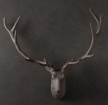 a deer's head with antlers is shown against a dark background in this image