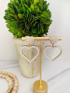 "Pearl Heart Beaded Earrings | Beautiful, elegant, and comfortable to wear, these beaded heart statement earrings are perfect for weddings, bridal showers, bridesmaids, Valentine's Day and every day! Lightweight and fun, the beaded Gold Pearl Heart earrings are made from tiny faux pearl seed beads and can easily be worn all day!  Perfect gift for moms, the bride-to-be, bachelorettes, girlfriends and more. 🎁 FREE SHIPPING when you spend $35 or more! SIZE: Approx 2\"l x 1\"w Posts are lead and nickel-free. FOLLOW along on INSTAGRAM @OhPoppyStyle for new arrivals, giveaways and everyday fun! Thank you for your support! We are very grateful and always here to HELP!  Have questions? Need gift ideas?  Please ask and we'll get back to you right away." Valentine's Day Pearl Heart Earrings, Elegant Heart Beaded Dangle Earrings, Elegant Beaded Earrings With Heart Beads For Parties, Elegant Beaded Heart Earrings For Party, White Heart Beads Earrings For Wedding, Elegant Beaded Heart Earrings, Elegant Beaded Heart Drop Earrings, Elegant Beaded Heart Earrings For Valentine's Day, Elegant Heart Beads Earrings For Valentine's Day