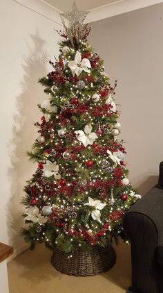 a decorated christmas tree in a living room