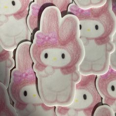 a bunch of hello kitty stickers on top of each other in pink and white