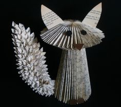 an animal made out of folded book pages