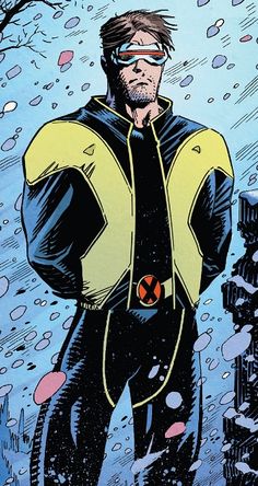 a man in a yellow and black suit standing next to a tree with snow on it