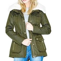 A Luxe Take On The Military Trend, This Nylon-Blend Coat Belongs In Your Cold-Weather Wardrobe. The Faux-Shearling Collar Keeps You Warm While Gold-Tone Hardware Adds A Glamorous Finishing Touch. Nylon-Blend Coat. Oversized Pointed Collar With Contrast Faux-Shearling Lining. Long Sleeves. Four Front Flap Pockets Plus Two Zipper Pockets. Cinched Waist With Interior Drawstring. Lace-Up Detail At Lower Back. Front Zipper Plus Snap-Button Closures. Quilted Lining. Shell: 77% Polyester, 23% Nylon. Lining And Faux Shearling: 100% Polyester. Machine Wash Brand New With Tag Size: Large *Please Note That The Color In Pictures Might Differ Slightly Due To Lighting, Flash And Screen Resolution. Spring Fur Coat For Cold Weather With Pockets, Cold Weather Spring Fur Coat With Pockets, Fur Coat With Pockets For Cold Weather In Spring, Faux Fur Parka For Cold Weather In Fall, Trendy Winter Utility Jacket For Cold Weather, Spring Faux Fur Outerwear With Pockets, Casual Fur Coat With Faux Fur Trim For Spring, Fall Parka With Faux Fur Trim And Long Sleeves, Winter Faux Fur Outerwear With Pockets