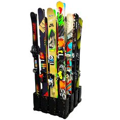 a rack holding skis and snowboards on top of each other in front of a white background