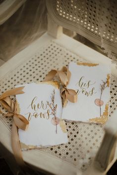 two cards that say just married and have bows on them sitting on top of a table