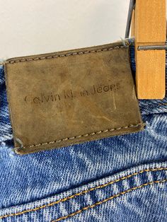 "Vintage Calvin Klein jeans featuring; ~ mid rise traditional 5 pocket styling zip fly with single button at the waist leather tag marked \"Calvin Klein Jeans\" on the front coin pocket leather label on back at waist marked \" Calvin Klein Jeans\" straight or stovepipe leg ~ of a heavy weight, 100% cotton denim in a medium blue wash ~ labeled \"Calvin Klein Jeans\", tag says these are a dark stone wash but they do show some fade, they are tagged a women's size 7 /8, measurements when laid out fl Vintage Calvin Klein Jeans, Straight Leg Blue Jeans, Vintage Calvin Klein, Leather Tag, Leather Label, Calvin Klein Jeans, Medium Blue, Heavy Weight, Jeans Straight