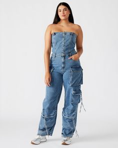 Expertly designed for a structured and voluminous fit, the strapless DUO jumpsuit is crafted from stretch denim. With adjustable ankle straps, this wide leg cargo jumpsuit offers a versatile silhouette that can be easily customized to your preference. Strapless stretch denim jumpsuit Snap closure on body with zipper fly Two side pockets, two back patch pockets, and five cargo pockets down the legs Bottom 3 cargo pockets feature extended zipper pulls Snap strap at hem to cinch ankles Inseam: 31" Casual Strapless Denim Jumpsuit, Strapless Denim Jumpsuit With Pockets For Summer, Utility Denim Cargo Pocket Overalls, Utility Denim Overall With Cargo Pockets, Casual Strapless Denim Jumpsuit With Pockets, High Waist Strapless Jumpsuit With Pockets, Trendy High Waist Strapless Jumpsuit With Pockets, Wide Leg Denim Strapless Jumpsuit, Trendy Strapless High Waist Jumpsuit With Pockets