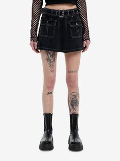 Every baddie needs a black denim skirt! This pleated one features front pockets with button closures and a removable grommet belt. Comes with white contrast stitching throughout.97% cotton; 3% spandexWash cold; dry flatStretchy materialLength: 14''ImportedListed in junior sizesModel is 5'10''Model wears size Small Baddie Needs, Skirts Hot, Grommet Belt, Pleated Denim Skirt, Pleated Denim, Black Denim Skirt, Stylish Skirts, Hoodie Girl, Cute Skirts