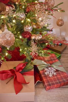 a christmas tree with presents under it