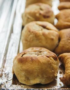 freshly baked pastries sitting on top of aluminum foil