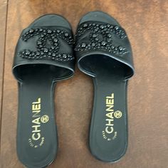 Adorable Slides From 19p. Lots Of Wear Left In These. Reinforced Soles Added As Well As An Extra 1/4 Inch On The Heel. Comes With Box And Dust Bag. Chanel Puffy Sandals, Chanel Mules With Pearl, Chanel Velcro Sandals, Chanel Tweed Sandals, Designer Black Slides With Buckle Closure, Chanel Pearls, Chanel Black, Chanel Shoes, Slides