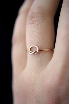 A sweet and simple everyday ring. It makes a great romantic gift, bridesmaids gift, or treat for yourself! Made by hand in Portland, OR Choose from 14kt gold fill, sterling silver or 14kt rose gold fill What is Gold Fill? Read our Buyer's Guide to Gold Jewelry to learn more! Cute Promise Rings, Infinity Knot Ring, Gold Knot Ring, Infinity Knot, Bridemaids Gifts, Silver Stacking Rings, Infinity Ring, Knot Ring, Wire Rings