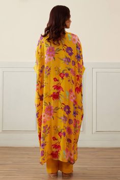 Yellow kaftan style kurta with all over floral prints in crepe base, embellished with pink beads. Comes with pant.
Components: 2
Pattern: Printed
Type Of Work: Floral Patterns
Neckline: Round
Sleeve Type: Batwing
Fabric: Kaftan: Organza, Lining: Cotton Silk, Pant: Chanderi
Color: Yellow
Other Details: 
Length:
Kaftan: 50 inches
Pant: 40 inches
Occasion: Mehendi and Haldi - Aza Fashions Spring Floral Print Kaftan For Daywear, Casual Silk Kaftan For Spring, Spring Viscose Tunic Kaftan, Spring Bohemian Viscose Kaftan, Multicolor Rayon Kaftan For Spring, Spring Rayon Kaftan With Kimono Sleeves, Spring Yellow Printed Kaftan, Rayon Maxi Length Kaftan, Spring Kaftan With Kimono Sleeves