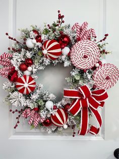 a wreath decorated with candy canes and ornaments