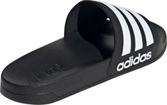 SHOWER SLIDES FOR VERSATILE COMFORT.From the pool deck to the shower to the couch, these slides are made for the work-hard-rest-hard lifestyle. The slip-on construction gives you a snug fit that's easy to kick on and off as needed. Lightweight cushioning keeps your feet cradled in all-day comfort. The adidas logo and 3-Stripes design complete the iconic Adilette style.Features: Regular fit Slip-on construction Synthetic upper Textile lining Contoured footbed Cloudfoam midsole Synthetic outsole Adidas Sandals, Shower Sandals, Adidas Slides, Shower Shoes, Black Slides, Best Shoes For Men, Adidas Adilette, Outdoor Sandals, Sport Sandals