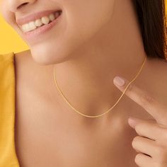 Elevate your style with the Vivid Cable Gold Chain, a stunning 18KT yellow gold necklace that exudes elegance and sophistication. This exquisite piece is perfect for adding a touch of luxury to your everyday outfits or for special occasions. Product Details Material: High-quality 18KT Yellow Gold Wieght: 2.570 g Length: 16 inches (40.64 cm) Style: Vivid cable link design Clasp: Secure and easy-to-use closure Key Features Premium Craftsmanship: Made from 18KT yellow gold for lasting shine and dur Elegant Yellow Chain Necklace With Delicate Chain, Yellow Cable Chain Necklace For Gift, Yellow Cable Chain Necklace As Gift, Gift Yellow Cable Chain Necklace, Elegant Yellow Necklace With Delicate Chain, Yellow Link Necklace Perfect For Gifts, Elegant Yellow Necklace With Gold Chain, Elegant Yellow Chain Necklace, Elegant Yellow Necklace With Adjustable Chain