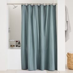 a bathroom with a shower curtain that is closed