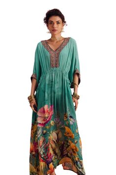 Green kimono sleeves maxi kaftan with botanic blossom print, beads hand embroidered V neckline, sleeves hem and gathered waist detailing with cowrie shell tassel tie-up. - Aza Fashions Floral Print Maxi Length Kaftan For Festivals, Floral Maxi Length Kaftan For Festivals, Festival Floral Print Maxi Kaftan, Festive Bohemian Kaftan With Floral Print, Bohemian Maxi Kaftan With Floral Print, Silk Floral Print Floor-length Kaftan, Spring Green Kaftan With Printed Motifs, Bohemian Floral Print Floor-length Kaftan, Floor-length Silk Kaftan With Floral Print