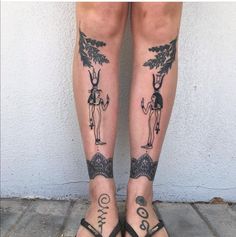 the legs are decorated with tattoos and symbols