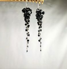 These black spinel earrings are designed in sterling silver with 3.5 inches of cascading gemstones.  These earrings are elegant and designed using three different sized stones for a tapered stiletto design.  Bold and flashy, these earrings make a great gift or the perfect statement piece in your own collection. Elegant Black Long Drop Chandelier Earrings, Elegant Black Beaded Chandelier Earrings, Black Sterling Silver Dangle Chandelier Earrings, Black Sterling Silver Chandelier Dangle Earrings, Elegant Black Crystal Earrings In Sterling Silver, Black Sterling Silver Dangle Crystal Earrings, Elegant Black Chandelier Earrings With Ear Wire, Spinel Earrings, Birthday Gift Best Friend