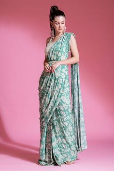 Jade green pre-draped saree with all-over flower prints. Comes with mirror hand work padded blouse and belt. - Aza Fashions Green Silk Saree Dress, Fitted Green Pre-draped Saree With Floral Print, Summer Green Pre-draped Saree, Festive Green Draped Dresses, Green Floral Print Saree For Summer, Elegant Green Floral Print Saree, Green Fitted Pre-draped Saree For Summer, Summer Green Floral Print Saree, Green Georgette Draped Saree