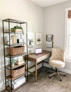 a room with a desk, chair and bookshelf