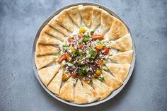 pita bread with vegetables and feta cheese on top