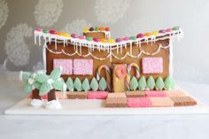 a gingerbread house decorated with icing and candy