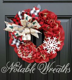 a red and black wreath with snowflakes on it